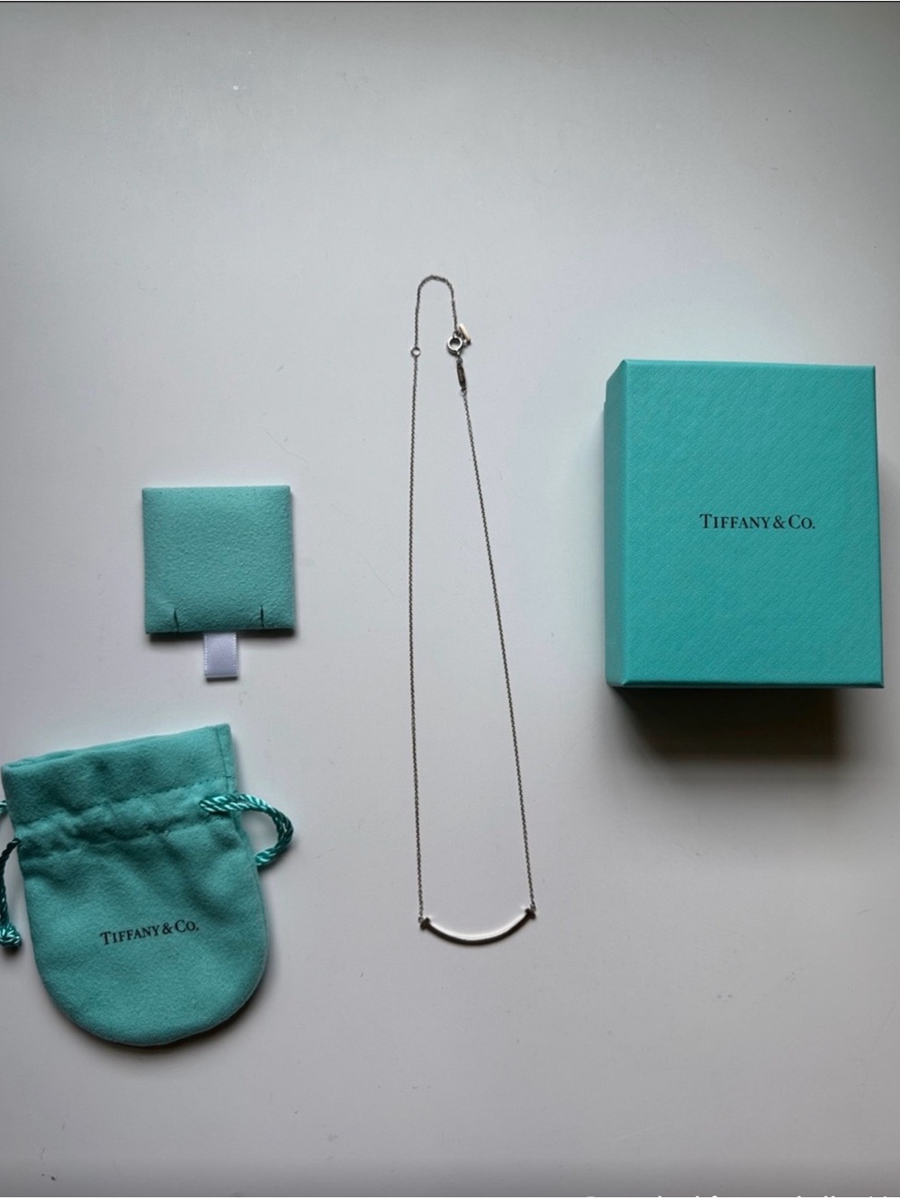 Tiffany & Co. Sterling Silver Smile Bar Necklace with Tiffany Blue Pouch and Box